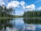 Beautiful lake view, beautiful sky, Calm lake reflection against the blue sky with white clouds