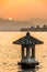 The Beautiful landsape sunset with Stone lantern at the West lake in hangzhou China