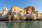 Beautiful landscape of Algarve, Portugal coast with sandstone cliffs, beach and ocean under blue sky