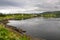 Beautiful landscape along with waters edge, with a village & church & mountains in the background, Saltstraumen, Bodo, Norway.