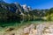 Beautiful landscape of alpine lake with crystal clear green water and mountains in background, Gosausee, Austria