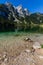 Beautiful landscape of alpine lake with crystal clear green water and mountains in background, Gosausee, Austria