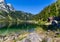 Beautiful landscape of alpine lake with crystal clear green water and mountains in background, Gosausee, Austria