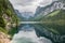 Beautiful landscape of alpine lake with crystal clear green water and mountains in background, Gosausee, Austria. Romantic place.