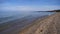 Beautiful landscape of Baikal lake surf wave sand shore blue sky and mountain in Olkhon island, Irkutsk Russia