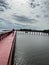 Beautiful landscape. Beautiful red long wooden bridge in Samut Sakhon province, Thailand. It is a dolphin watching spot.