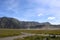 A Beautiful Landscape in Bromo with Paths, Grass, and Hills, in The Noon