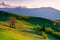 beautiful landscape of carpathians with meadows rolling through forested hills in