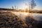 Beautiful landscape. Climate concept. Bright sun rises on cold frosty morning. Fog above river