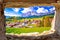 Beautiful landscape of Cortina d` Ampezzo in Dolomites Alps view through stone window