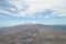 Beautiful landscape of a dry vulcanic area with blue lakes and a mountain with snow capped Peak in the Tongariro National Park