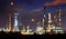 beautiful landscape dusky sky of heavy industry oil refinery plant with dazzled lighting