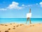 Beautiful landscape with easel on sandy beach