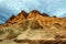 beautiful landscape of the famous golden canyon in death valley in california with manly beacon in the background