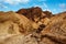 beautiful landscape of the famous golden canyon in death valley in california with manly beacon in the background