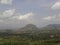 Beautiful landscape of granite mountains with green trees and clouds