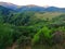 Beautiful landscape of hills covered with lush greenery in Riano, Spain