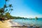 Beautiful landscape of Hon Thom beach, Phu Quoc island, Vietnam, Asia with tourist, chairs and umbrella. White sand and coco palms