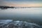 Beautiful landscape image of colorful sunrise over ocean and derelict pier in distance