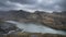 Beautiful landscape image of Dinorwig Slate Mine and snowcapped Snowdon mountain in background during Winter in Snowdonia with