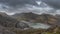 Beautiful landscape image of Dinorwig Slate Mine and snowcapped Snowdon mountain in background during Winter in Snowdonia with