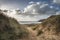 Beautiful landscape image of Freshwater West beach with sand dun