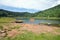 Beautiful landscape of the Laguna Verde with a boat, in Apaneca, Ruta de Las Flores itinerary, El Salvador, Central America.