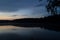 Beautiful landscape of the lake with forest shores in the early morning