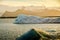 Beautiful landscape with a large iceberg in a lake and mountains in the background. Jokulsarlon Glacier Lagoon in Iceland