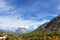 A beautiful landscape with majestic mountains covered in lush greenery under a clear blue sky. Cirali, Turkey