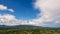 Beautiful landscape mountain green field grass meadow white cloud blue sky on sunny day. Majestic green scenery big mountain hill