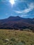 Beautiful landscape of mountain peak in the natural untouched environment with colorful forest and grass valley