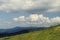 Beautiful landscape with mountain and propeller farm on the top