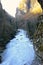 Beautiful landscape of mountain river in forest. Bright panorama of violent river between stones in spring