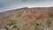 A beautiful landscape of mountain villages of Tajikistan in springtime taken from a drone. Residential buildings located