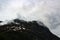 Beautiful landscape with mountains and grey clouds in Norway, Geirangerfjord