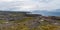 Beautiful landscape of the North Sea coast with stones covered with colorful moss. View from the mountain.Teriberka, Barents Sea,