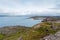 Beautiful landscape of the North Sea coast with stones covered with colorful moss. View from the mountain.Teriberka, Barents Sea,