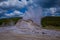 Beautiful landscape of old faithful geyser, surrounded by vapor at Midway Geyser Basin, Yellowstone National Park