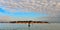 Beautiful landscape with old San Michele cemetery island in background in the Venetian Lagoon with cloudy blue sky in Venice, Ital