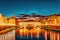 Beautiful landscape, panorama on historical view of the Florence - Ponte Vecchio is a bridge in Florence at night time. Italy