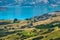 Beautiful landscape of a peninsula. cloudy sky fresh ocean and grassland mountain. New Zealand agriculture. I