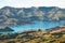 Beautiful landscape of a peninsula. cloudy sky fresh ocean and grassland mountain. New Zealand agriculture. I