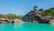 Beautiful landscape people on rock is a symbol of Similan Islands, blue sky and cloud over the sea during summer at Mu Ko Similan