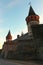 Beautiful landscape photo of ancient Kamianets-Podilskyi Castle. High and thick stone walls with towers against blue sky