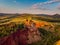 Beautiful landscape of the remains of an old sleeping volcano crater with red clay and vibrant colors