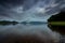 Beautiful landscape of reservoir in the morning. Mountain and green tree forest. Cloudy sky. Clear water in the river. Fresh air.