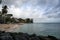 Beautiful landscape with a rocky beach and seaside architecture on a cloudy day