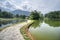 Beautiful landscape scene at the quiet green foliage lake.