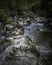 Beautiful landscape of Scotland ,UK.Stream with rocks in woodland